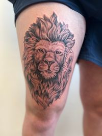Een tattoo van een leeuw